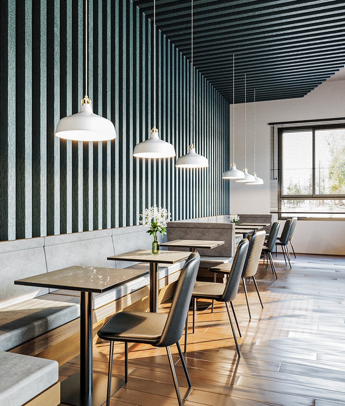 Salle de restaurant équipée de tables rondes à piètement central